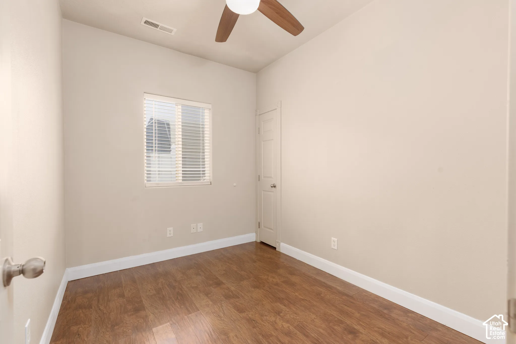 Bedroom 3/Flex room with dark wood finished floors and a ceiling fan