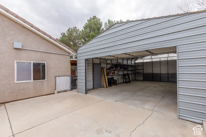 Spacious workshop/additional garage with outlets and garage door opener