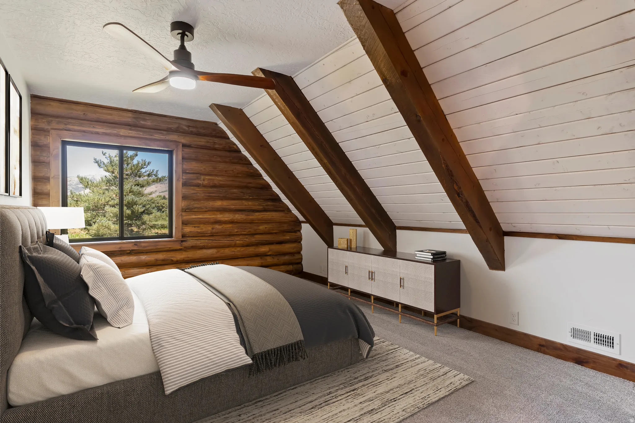 Bedroom featuring vaulted ceiling with beams, carpet flooring, rustic walls, wooden ceiling, and a ceiling fan