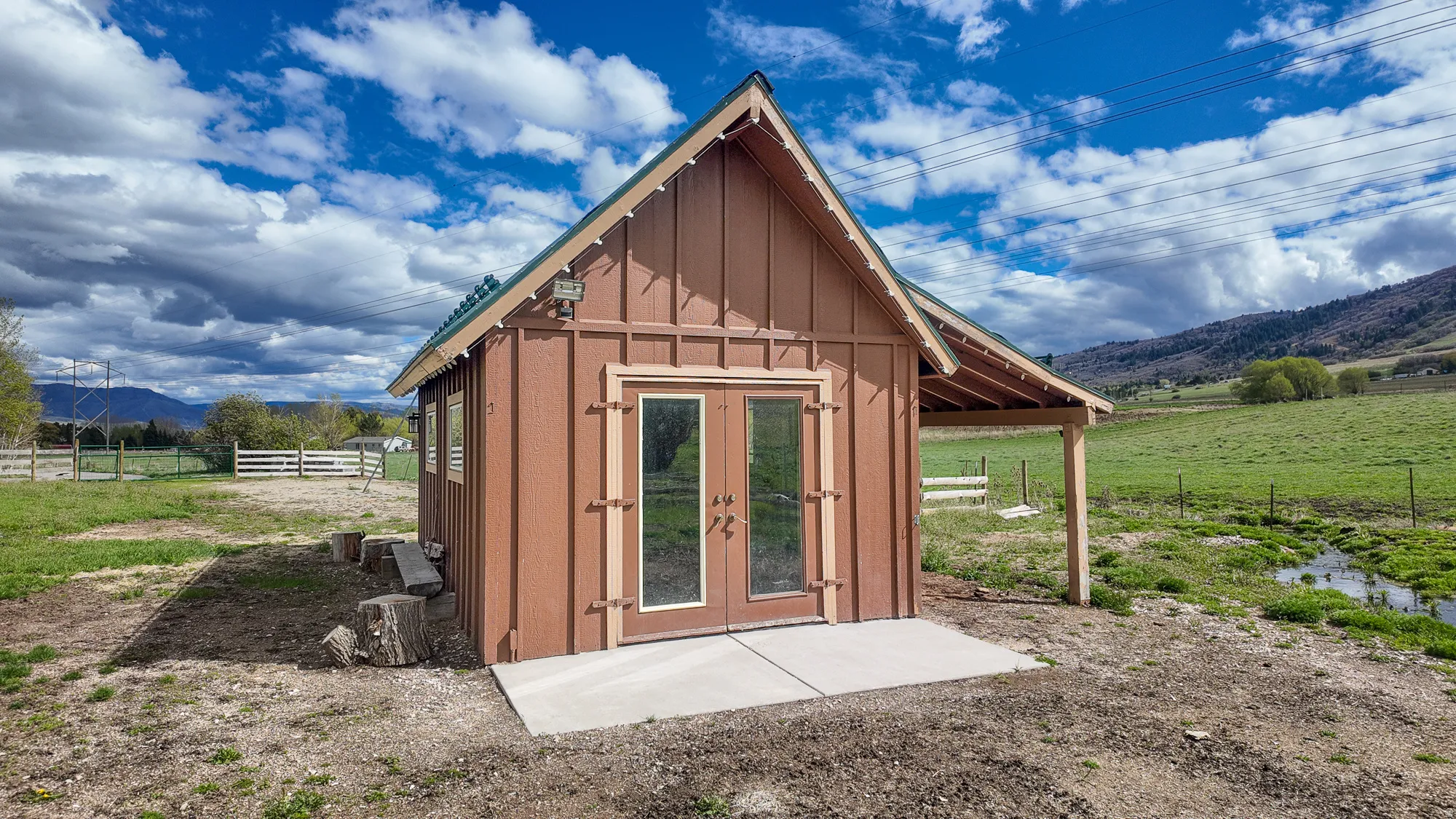 View of outdoor structure with a mountain view and a view of countryside