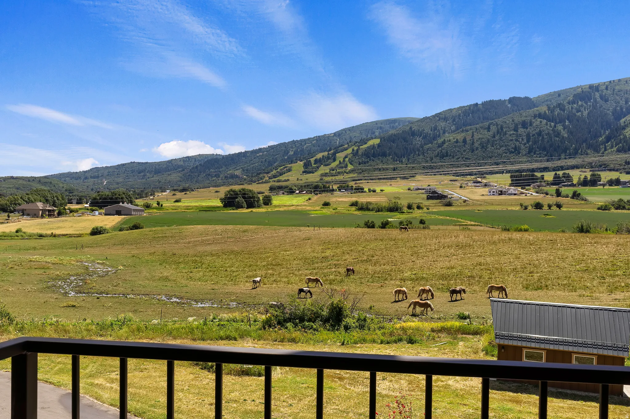 View of mountain background with rural landscape and agricultural land
