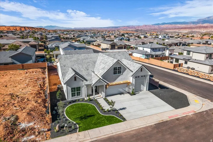 Aerial perspective of suburban area with a mountain backdrop