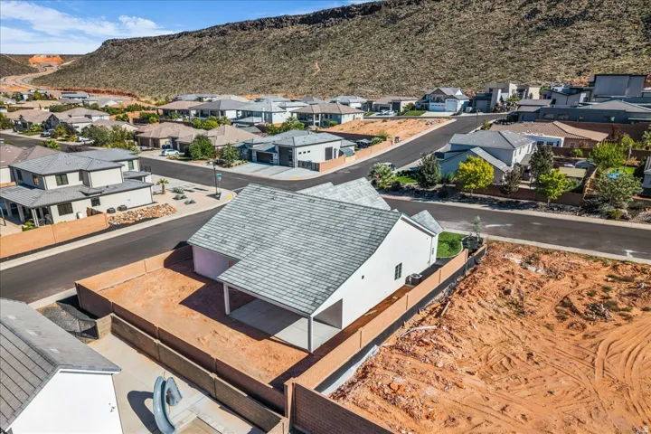 Aerial view of residential area with a mountainous background