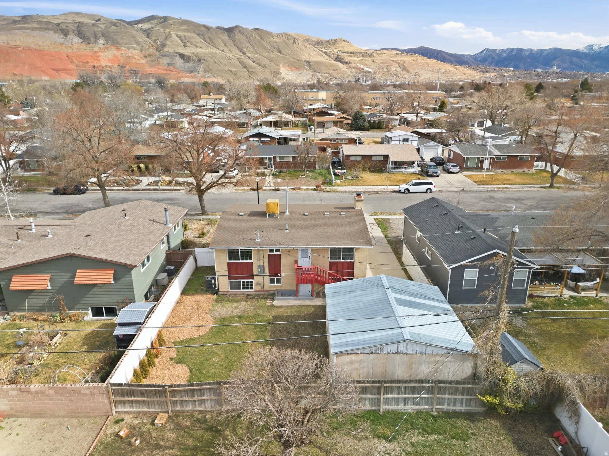 Aerial view of residential area featuring a mountain backdrop