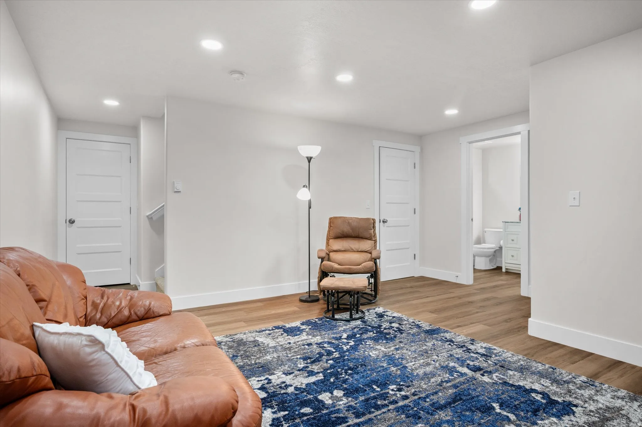 Sitting room featuring light wood-style floors and recessed lighting