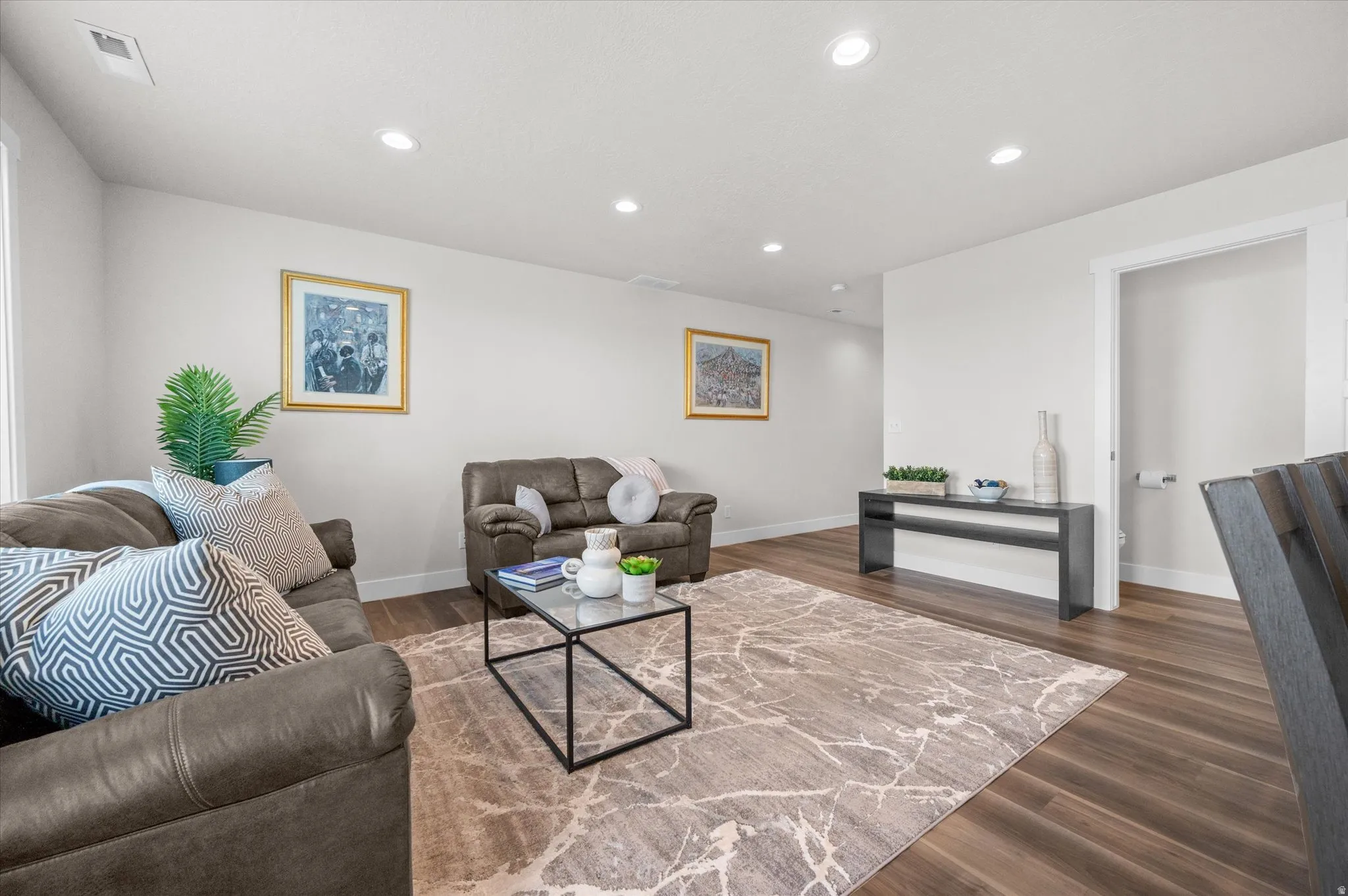 Living area featuring recessed lighting and dark wood finished floors