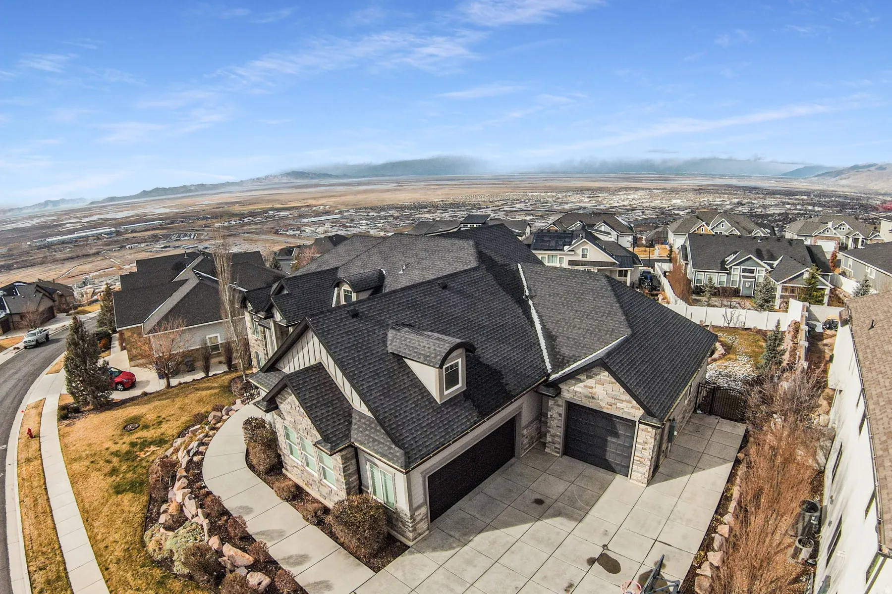 Aerial view of residential area featuring a mountain backdrop