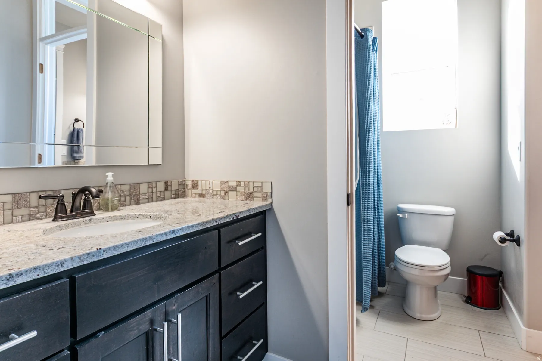Bathroom featuring vanity and a shower with curtain