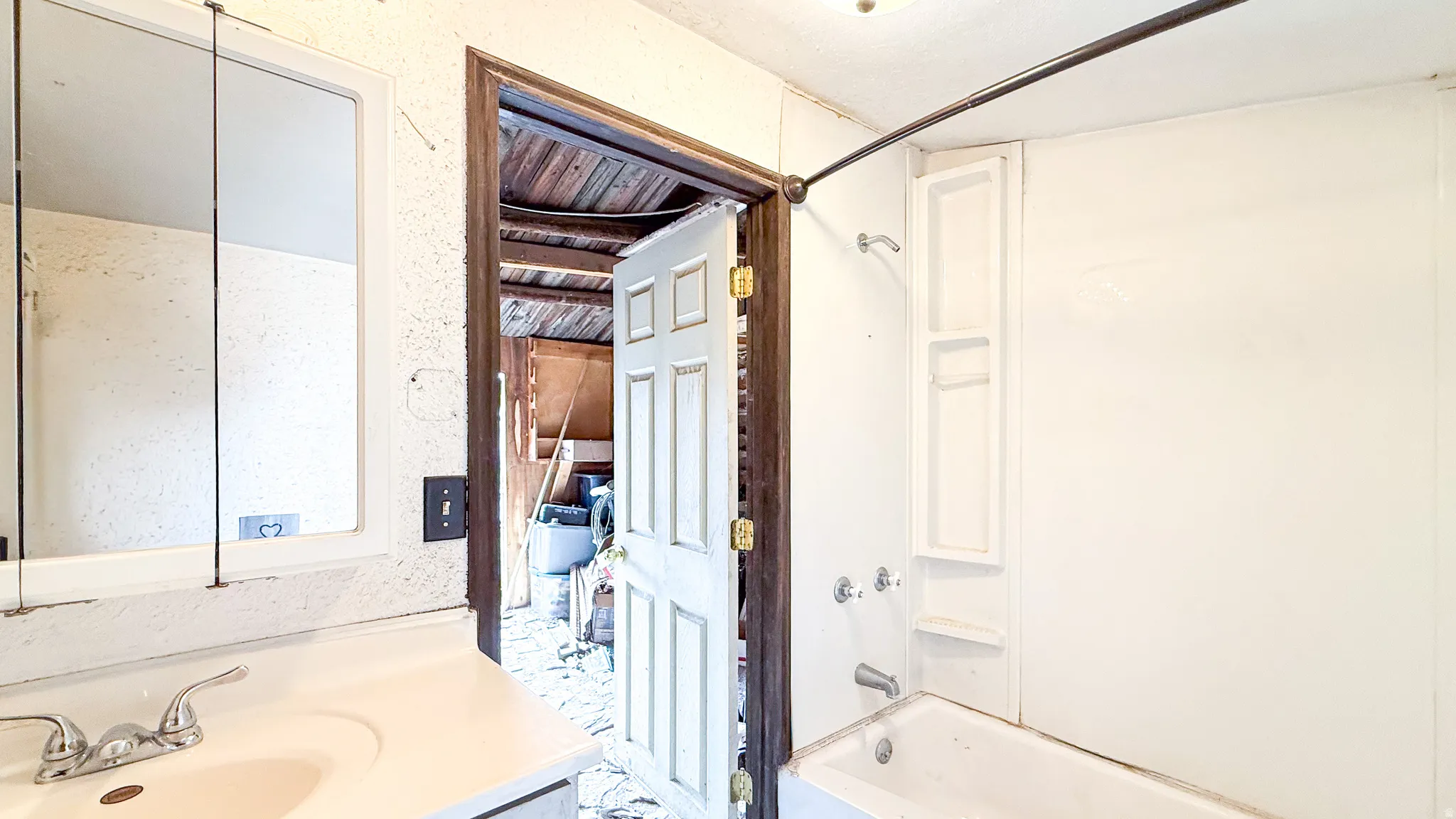 Full bathroom in cabin featuring shower / washtub combination and vanity