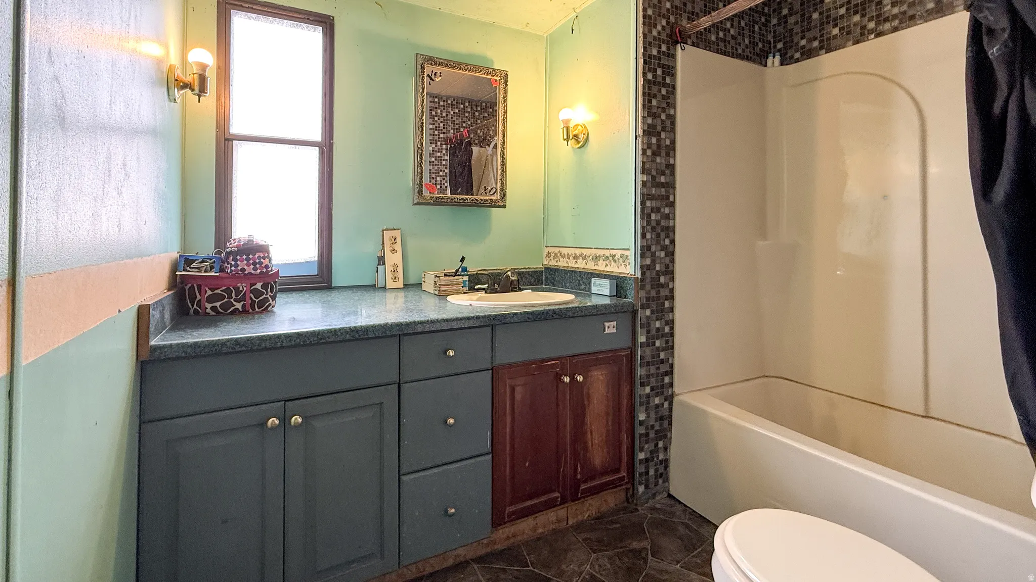 Full bathroom with vanity and washtub / shower combination