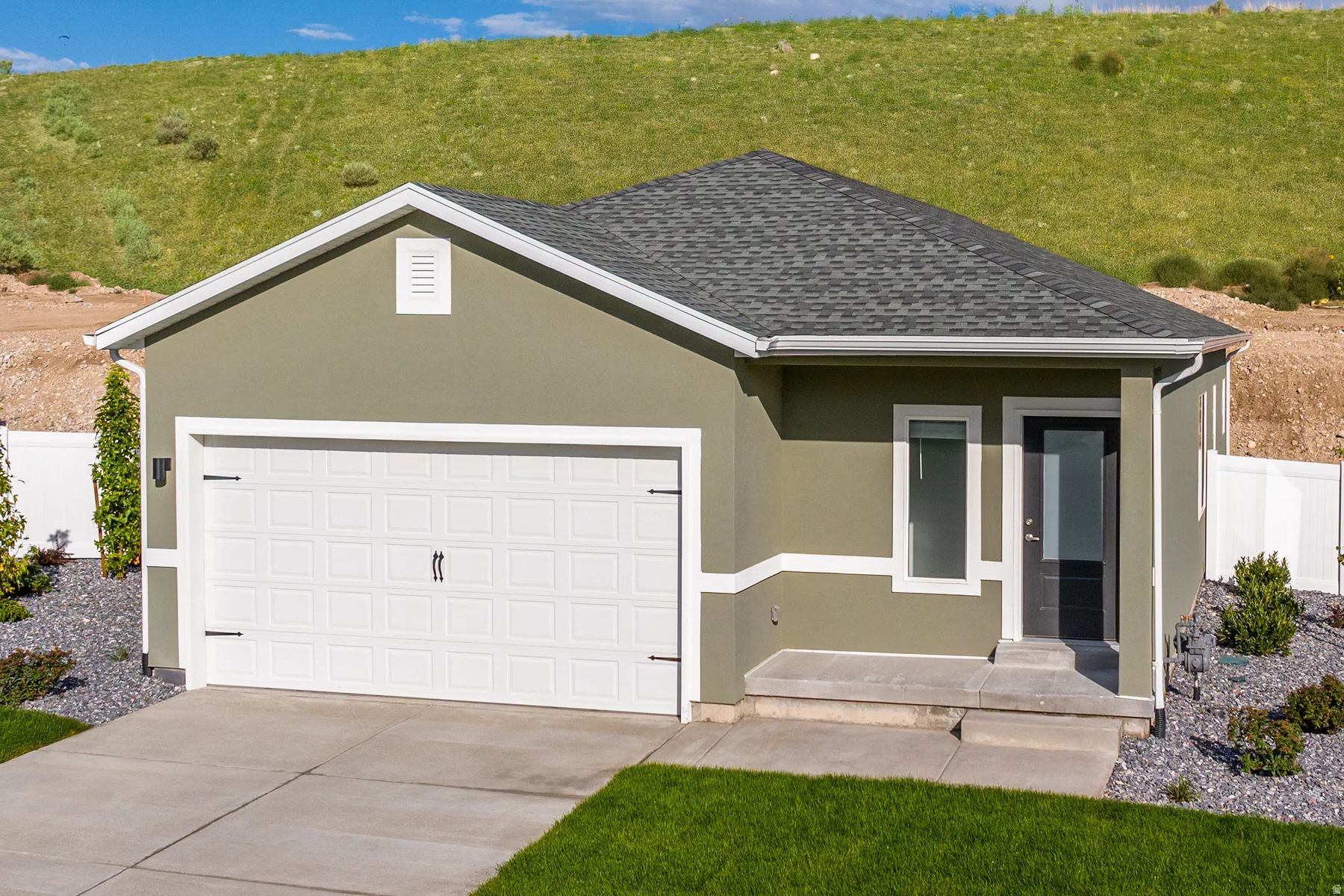 View of front of house with stucco siding, a garage, concrete driveway, roof with shingles, and covered porch