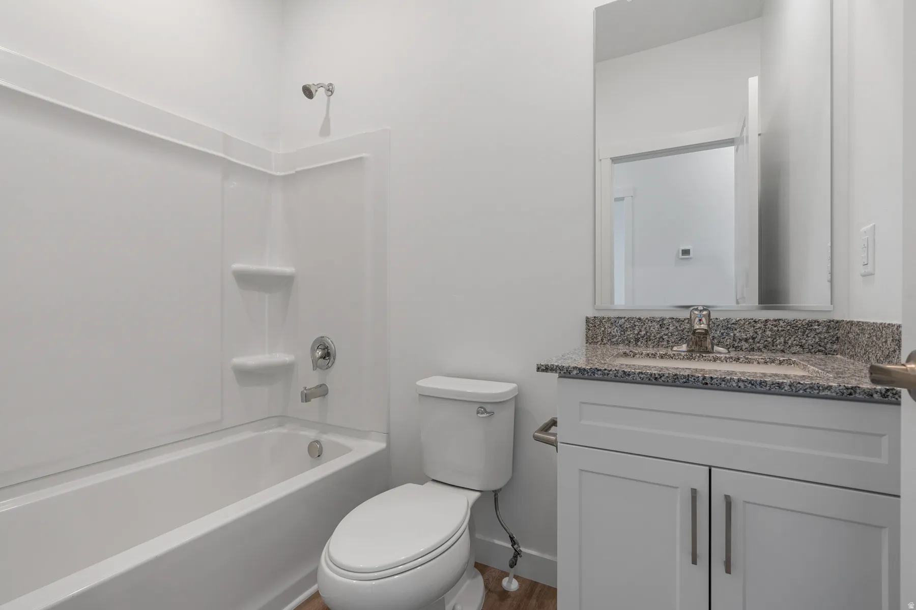 Bathroom with vanity and shower / washtub combination
