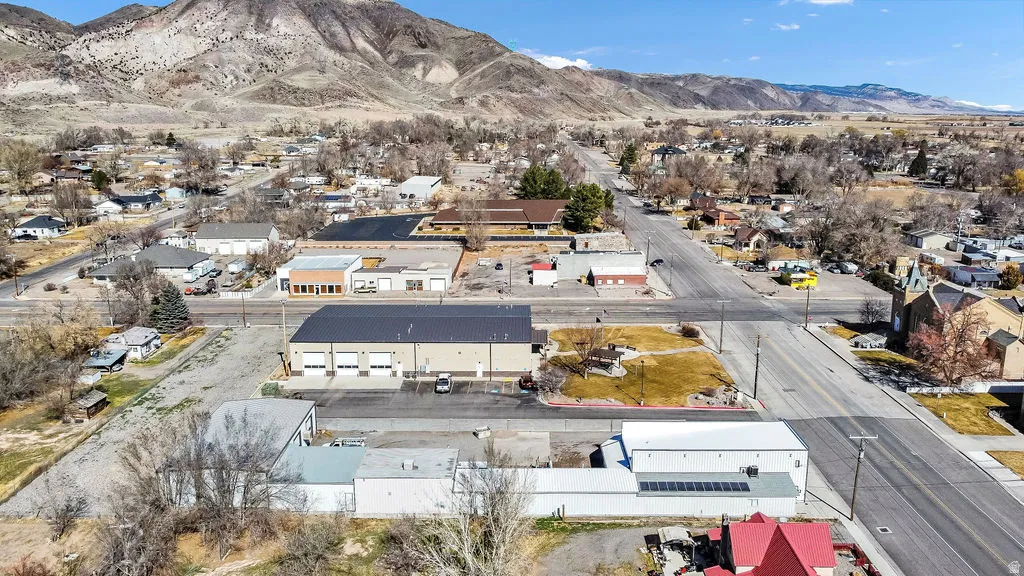Aerial perspective of suburban area with a mountainous background
