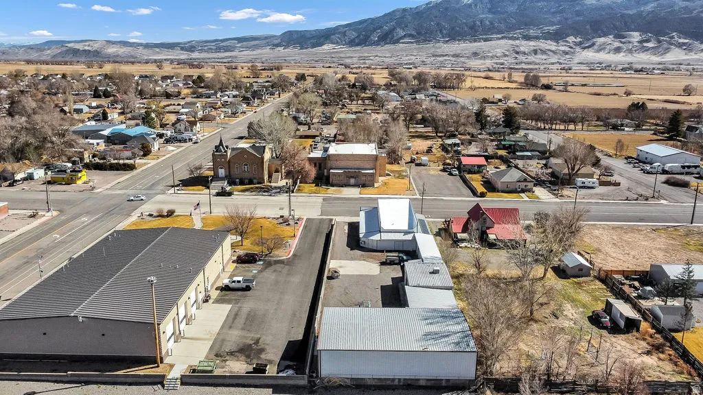 Aerial perspective of suburban area with a mountainous background