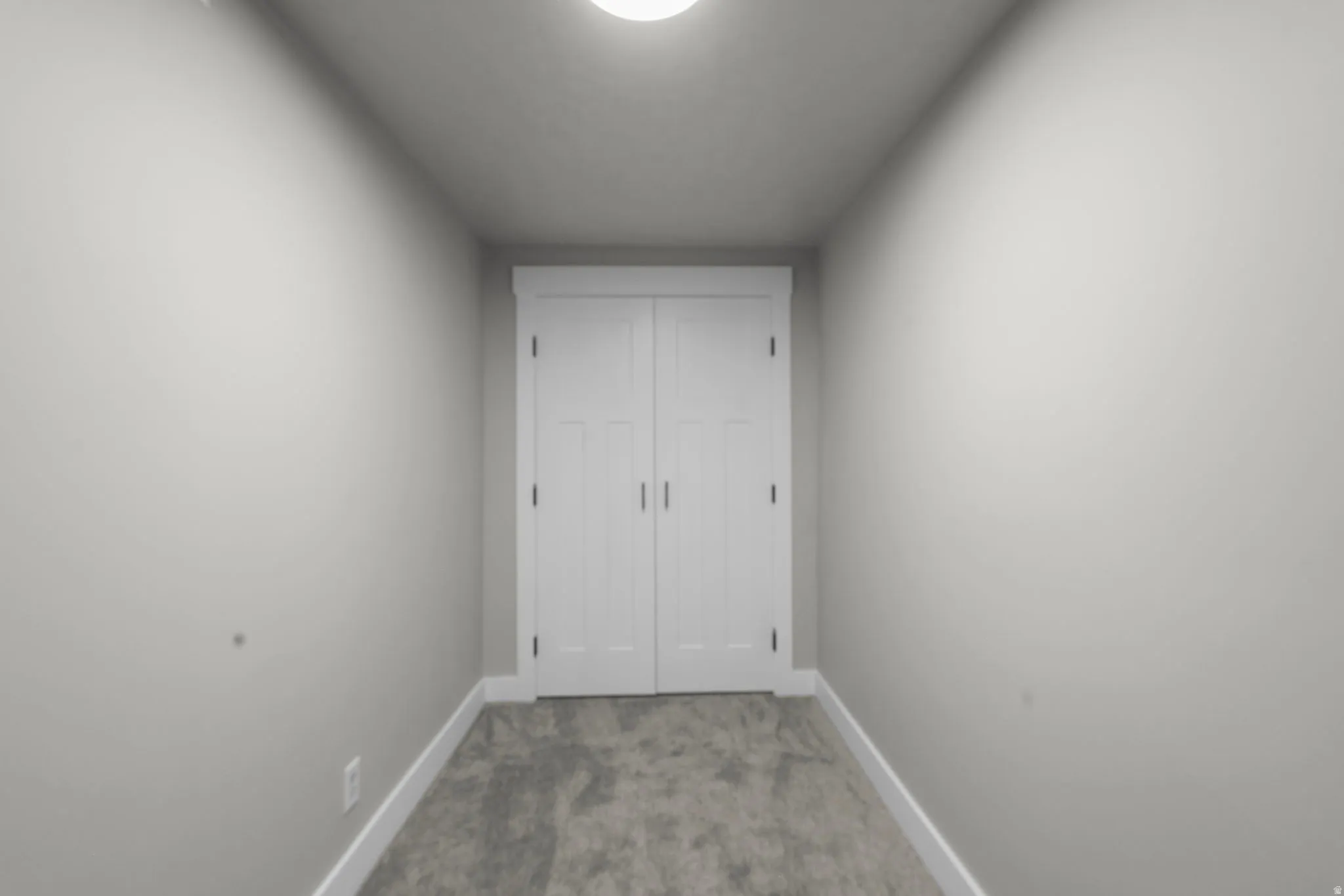 Unfurnished bedroom featuring carpet flooring and a closet