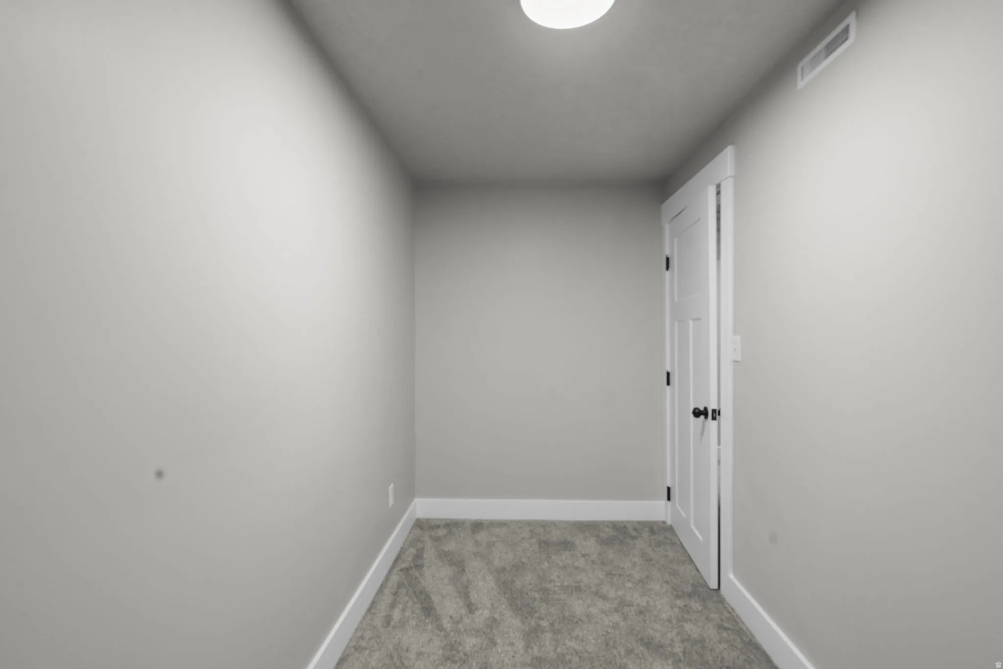 Hall with light carpet and baseboards