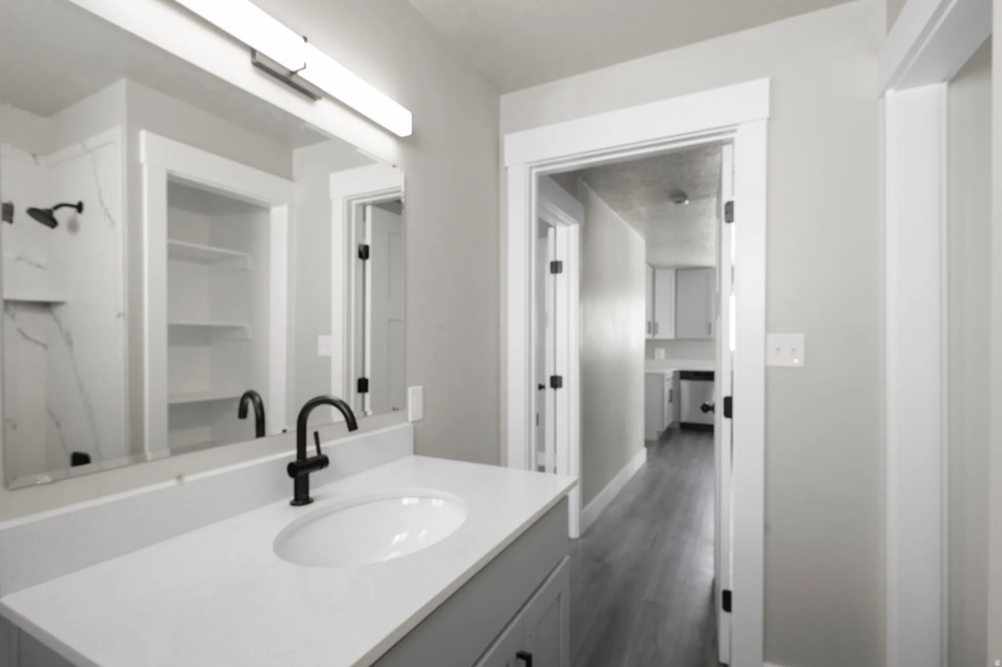 Bathroom with vanity and dark wood-style floors