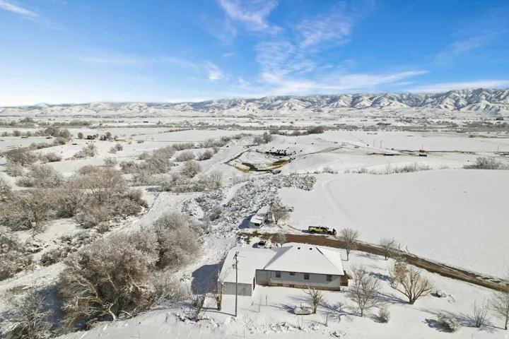 Snowy aerial view with a mountain view