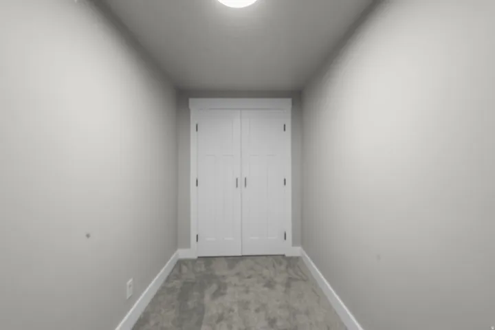 Unfurnished bedroom featuring carpet flooring and a closet