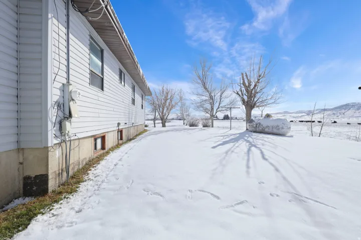 View of yard covered in snow