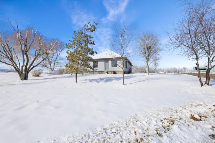 View of yard covered in snow