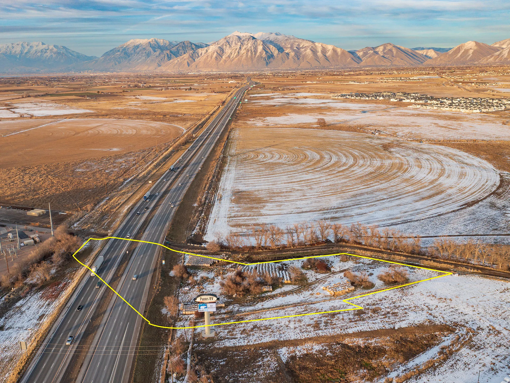 Aerial view of sparsely populated area with a mountain backdrop
