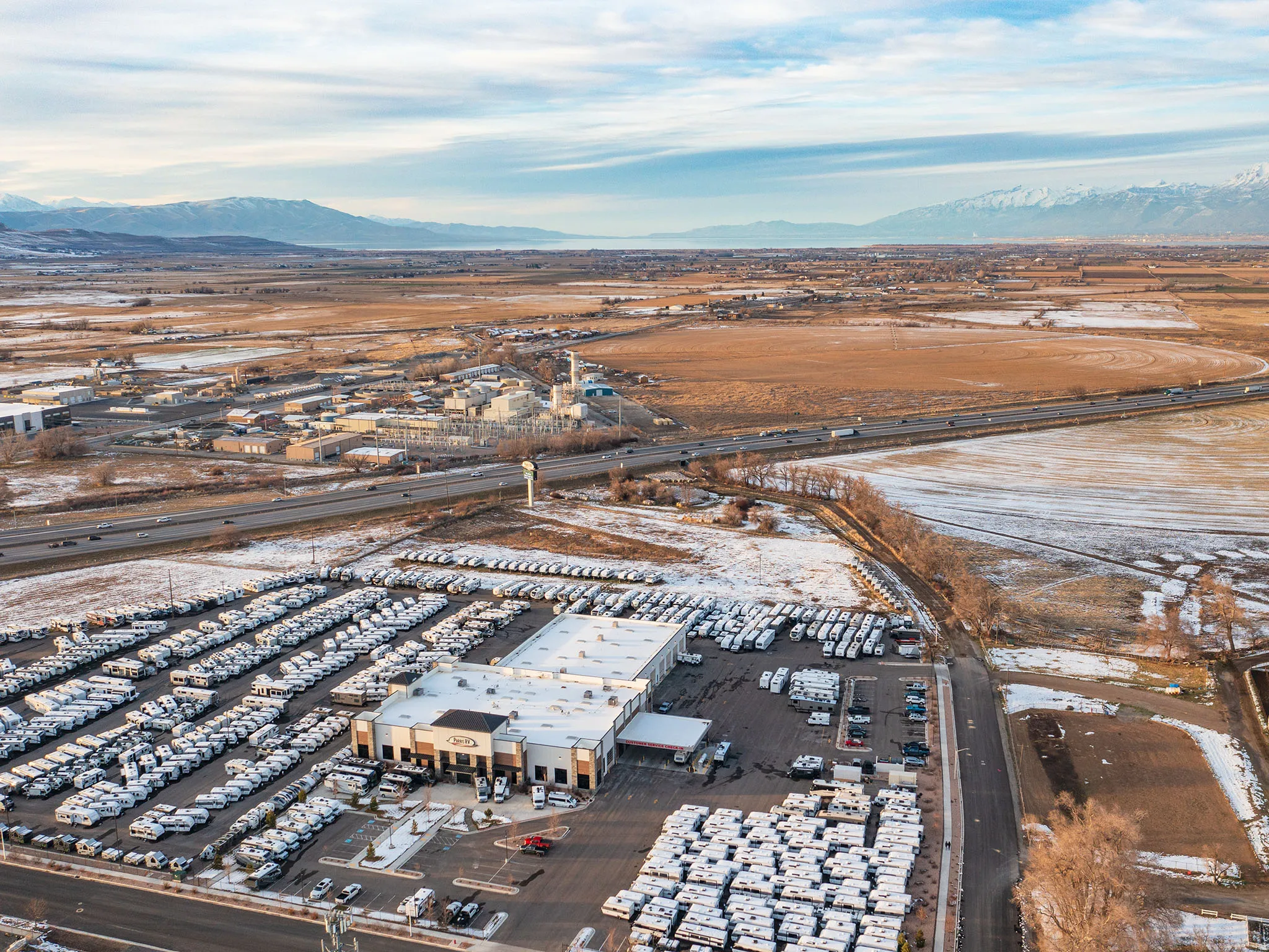 Aerial view of property's location with a mountain backdrop