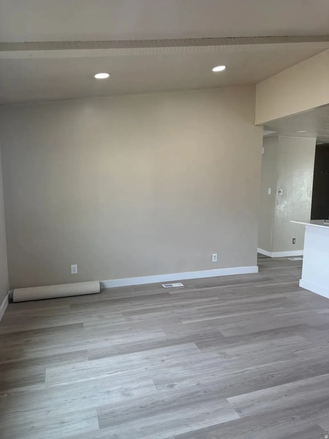 Unfurnished room with light wood-style floors and recessed lighting