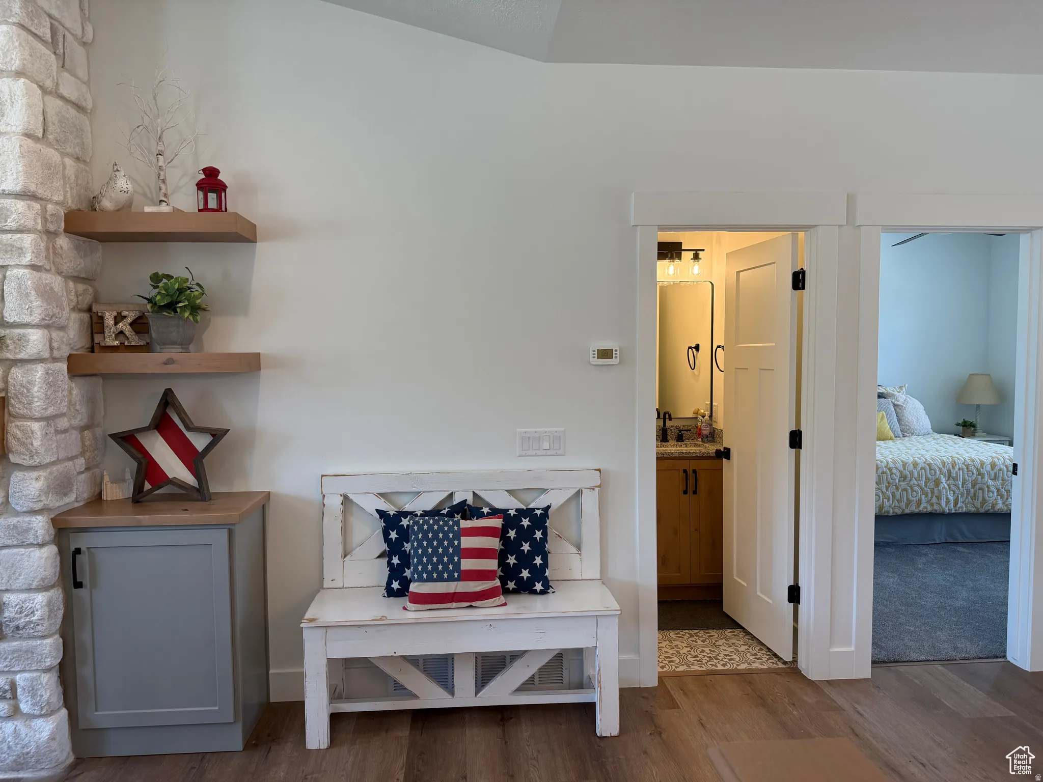 Sitting room with dark wood-style floors and baseboards