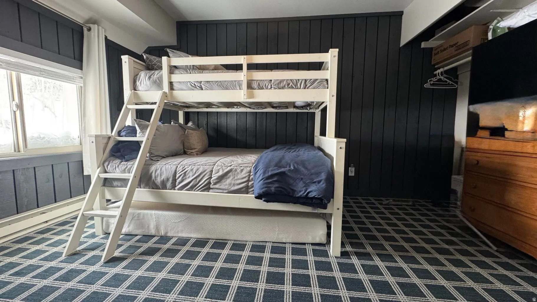 Bedroom with wooden walls
