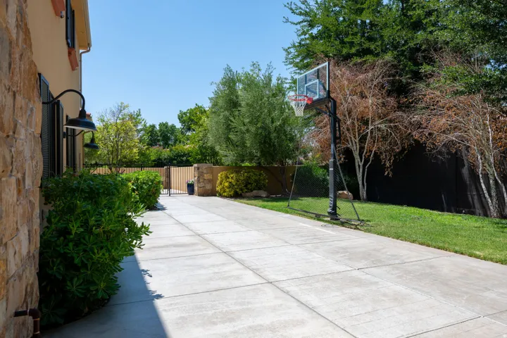 View of patio featuring a gate