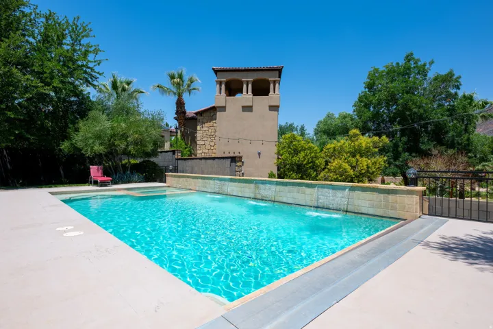 Integrated pool / hot tub with a patio area