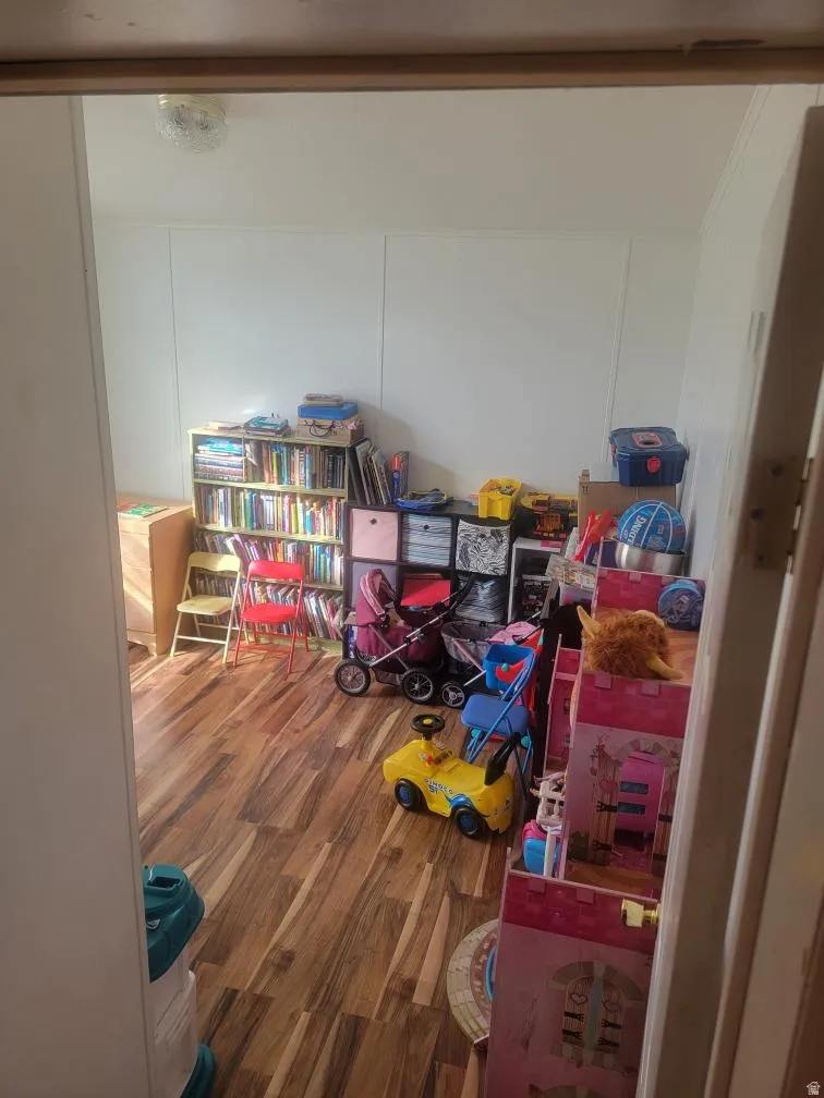 Game room featuring wood finished floors