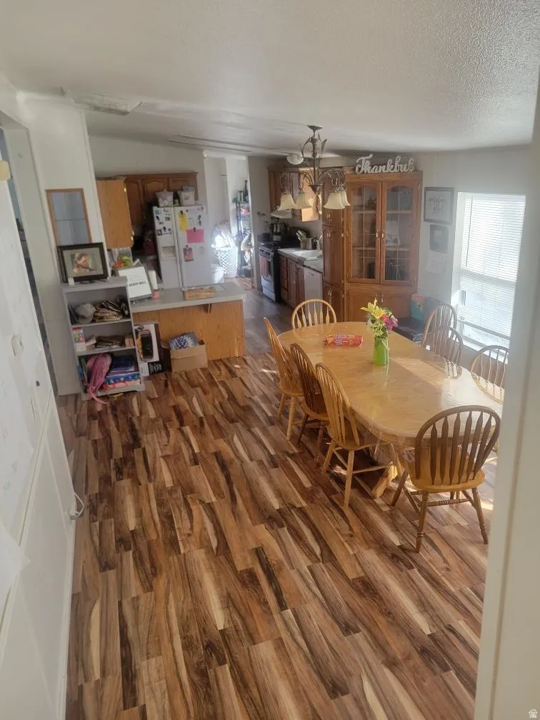 Dining area with dark wood finished floors