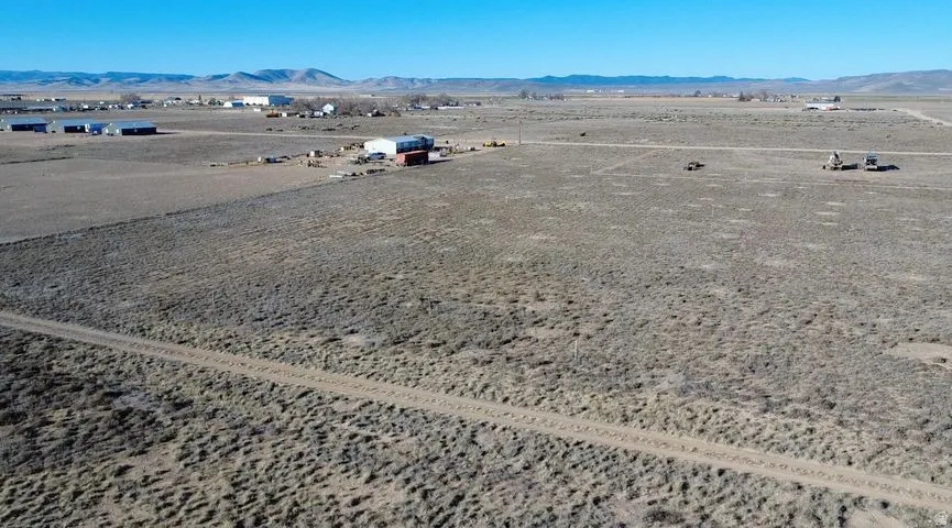 Aerial view of sparsely populated area with a mountain backdrop