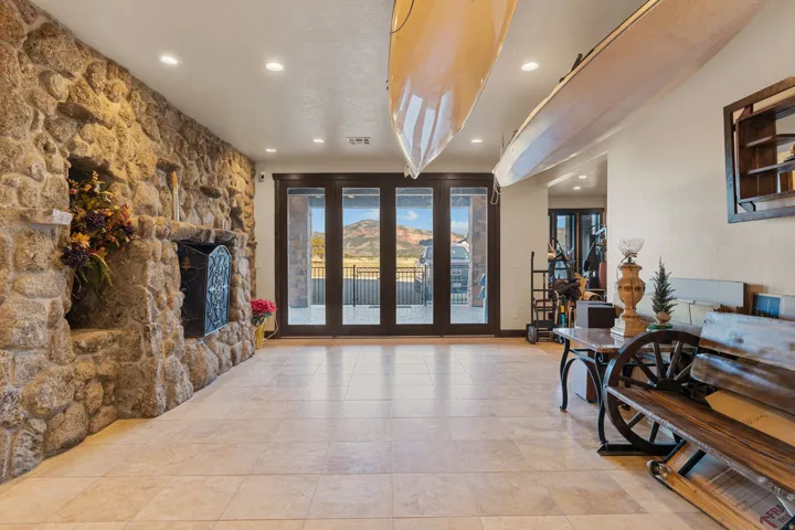 Living area featuring recessed lighting and a fireplace