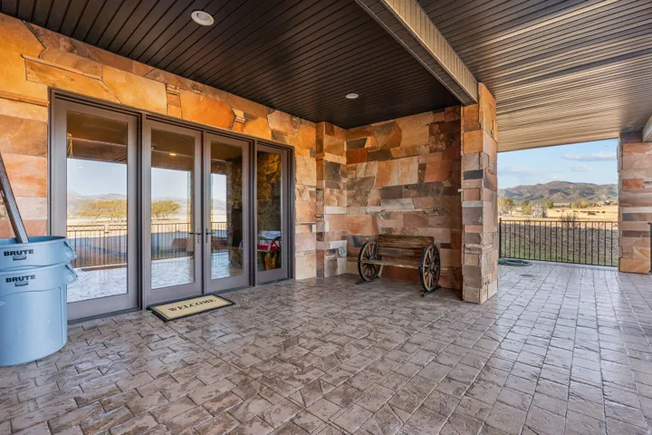 View of patio / terrace featuring a mountain view and french doors