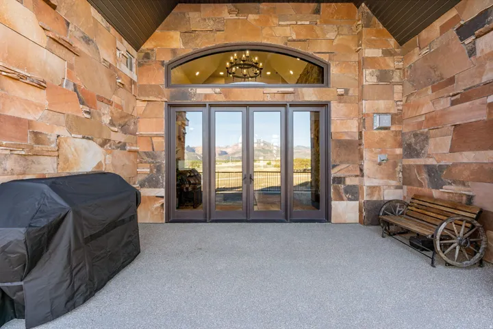 View of exterior entry featuring french doors and a mountain view
