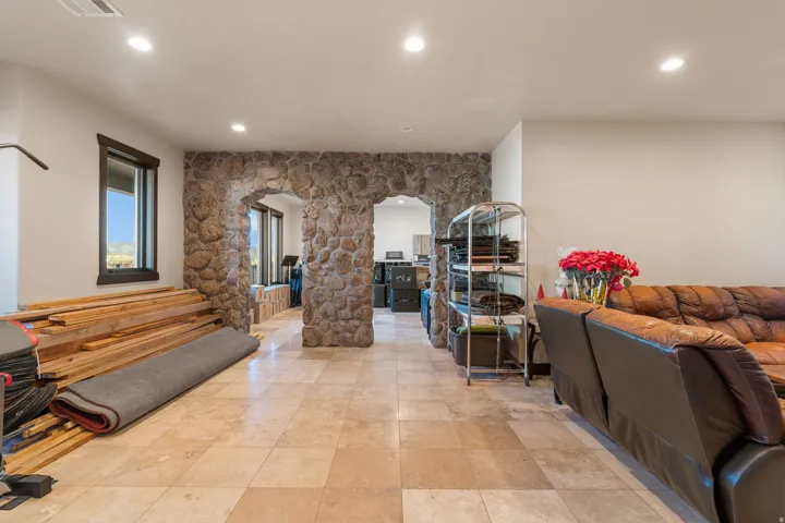 Hallway with arched walkways and recessed lighting