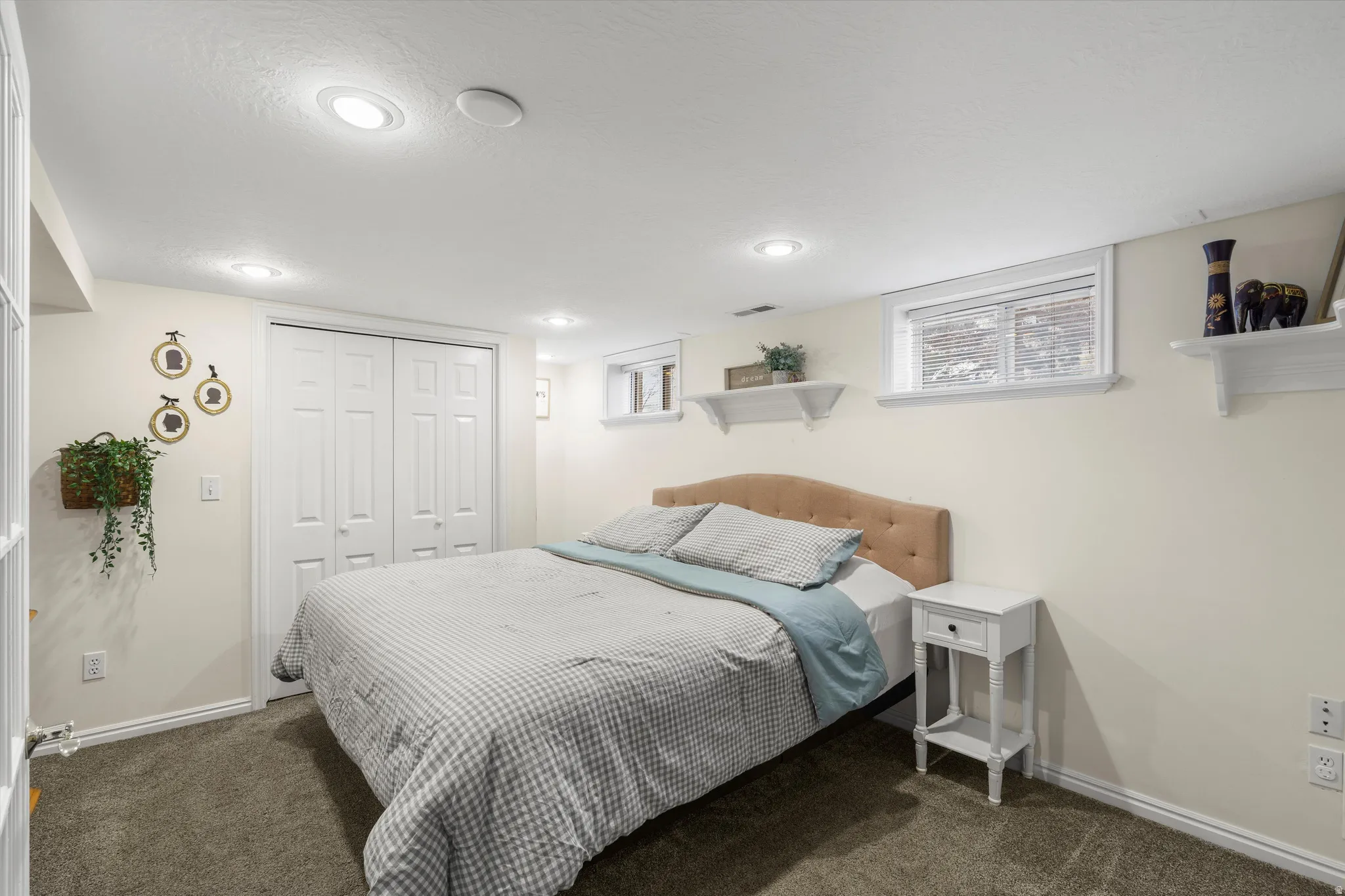 Bedroom with a closet and carpet floors