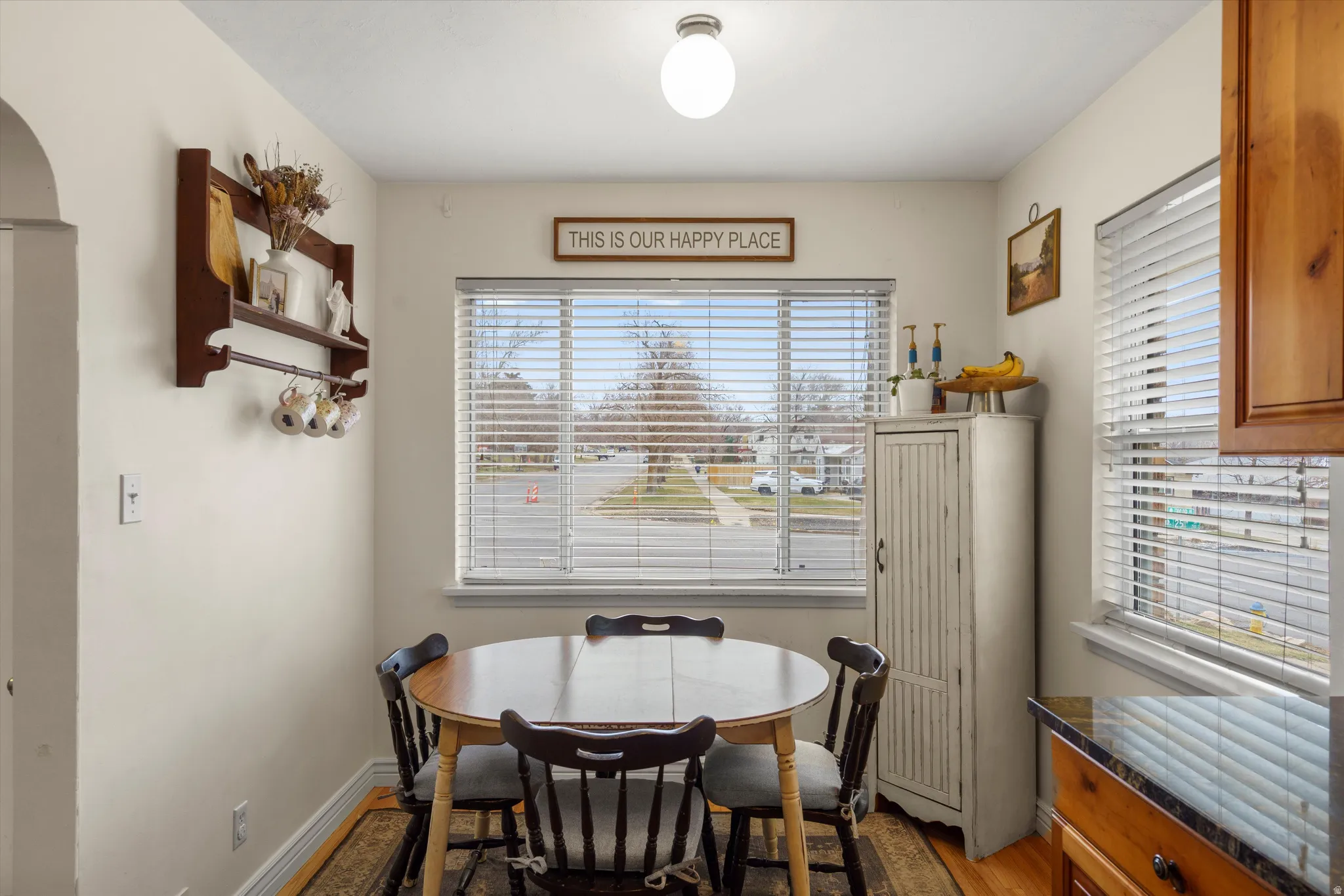 Dining area with baseboards and wood finished floors