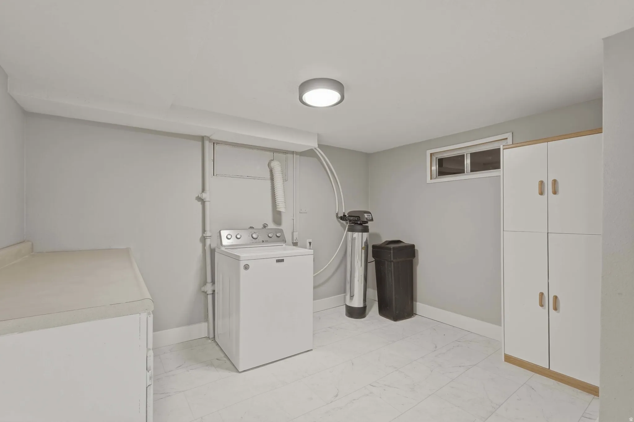 Large laundryroom with potential to add a kitchenette or another half bathroom.