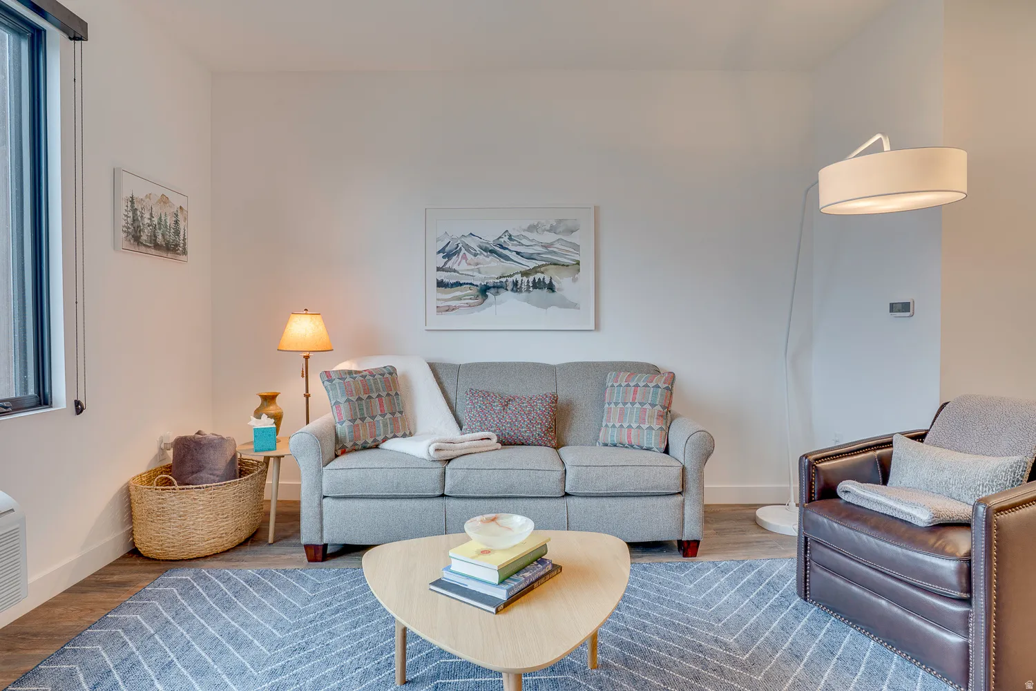 Living room with wood finished floors and baseboards