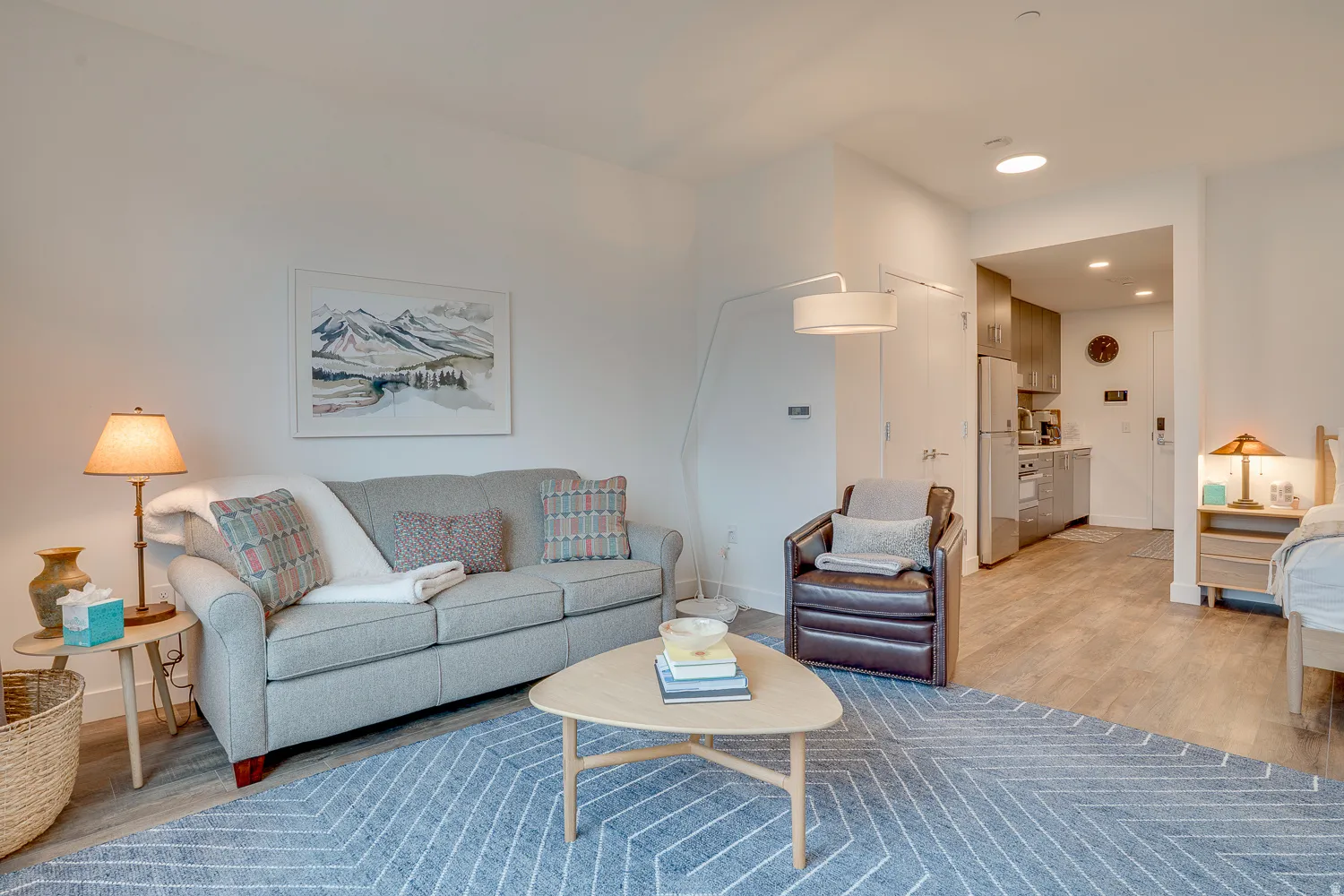 Living room featuring light wood-type flooring and recessed lighting