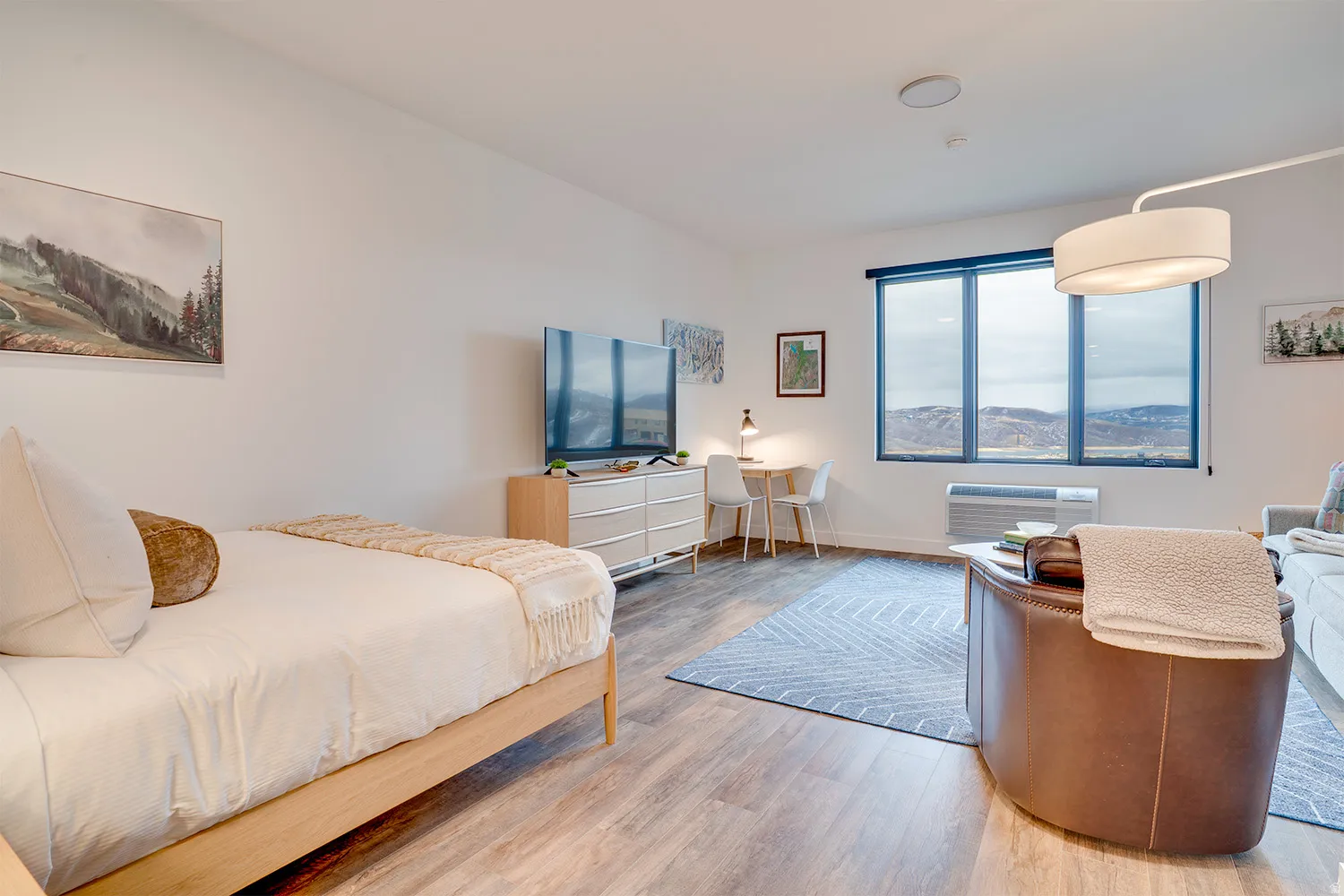 Bedroom featuring light wood-style flooring and baseboards