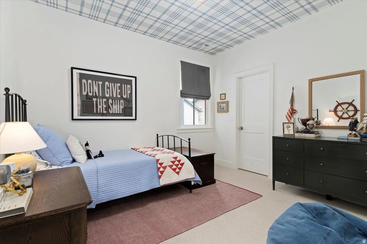 Bedroom with carpet flooring and baseboards