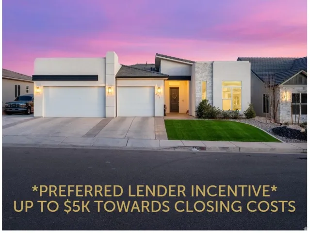 Contemporary home with an attached garage, stucco siding, concrete driveway, and stone siding