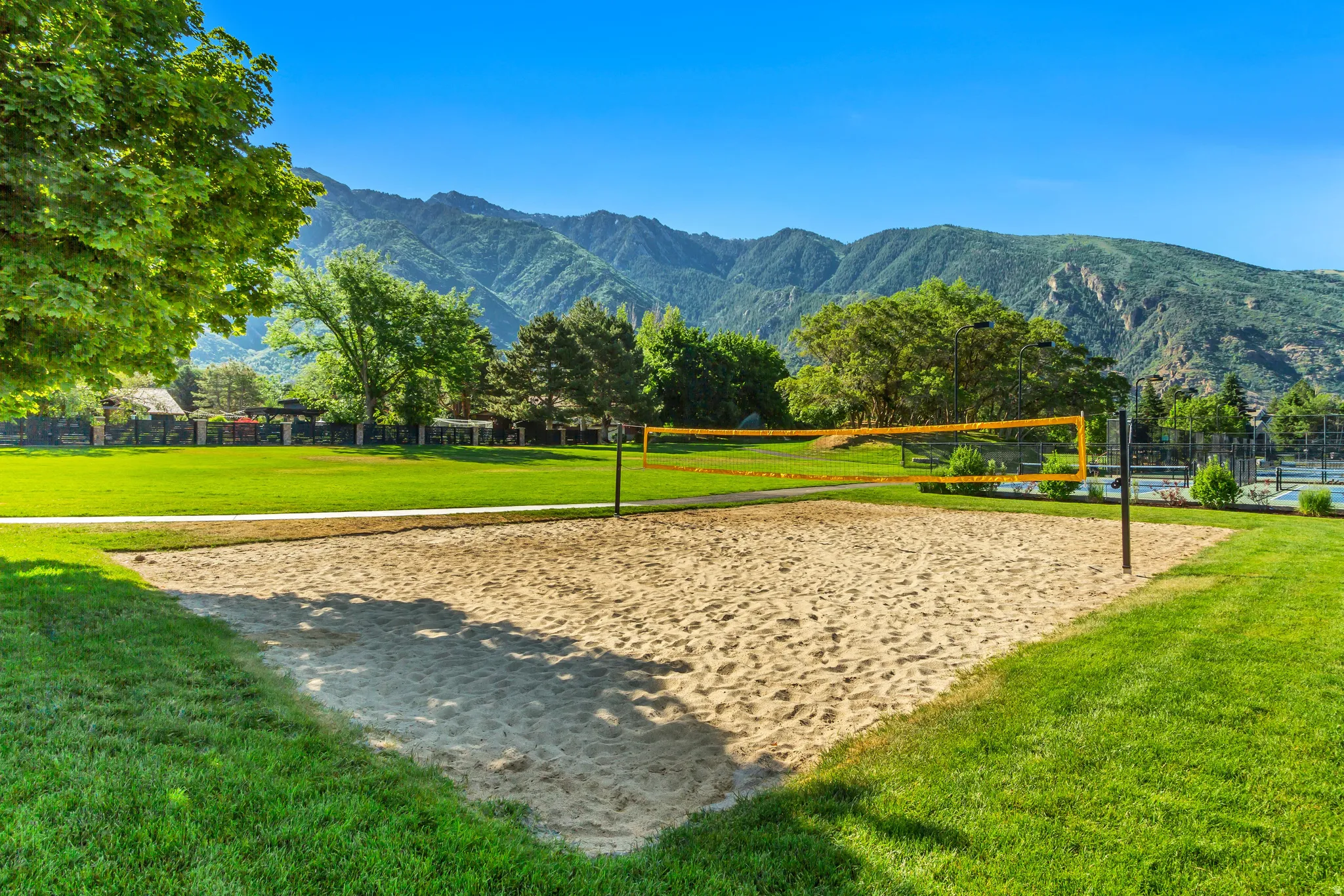 View of home's community featuring volleyball court and a mountain view