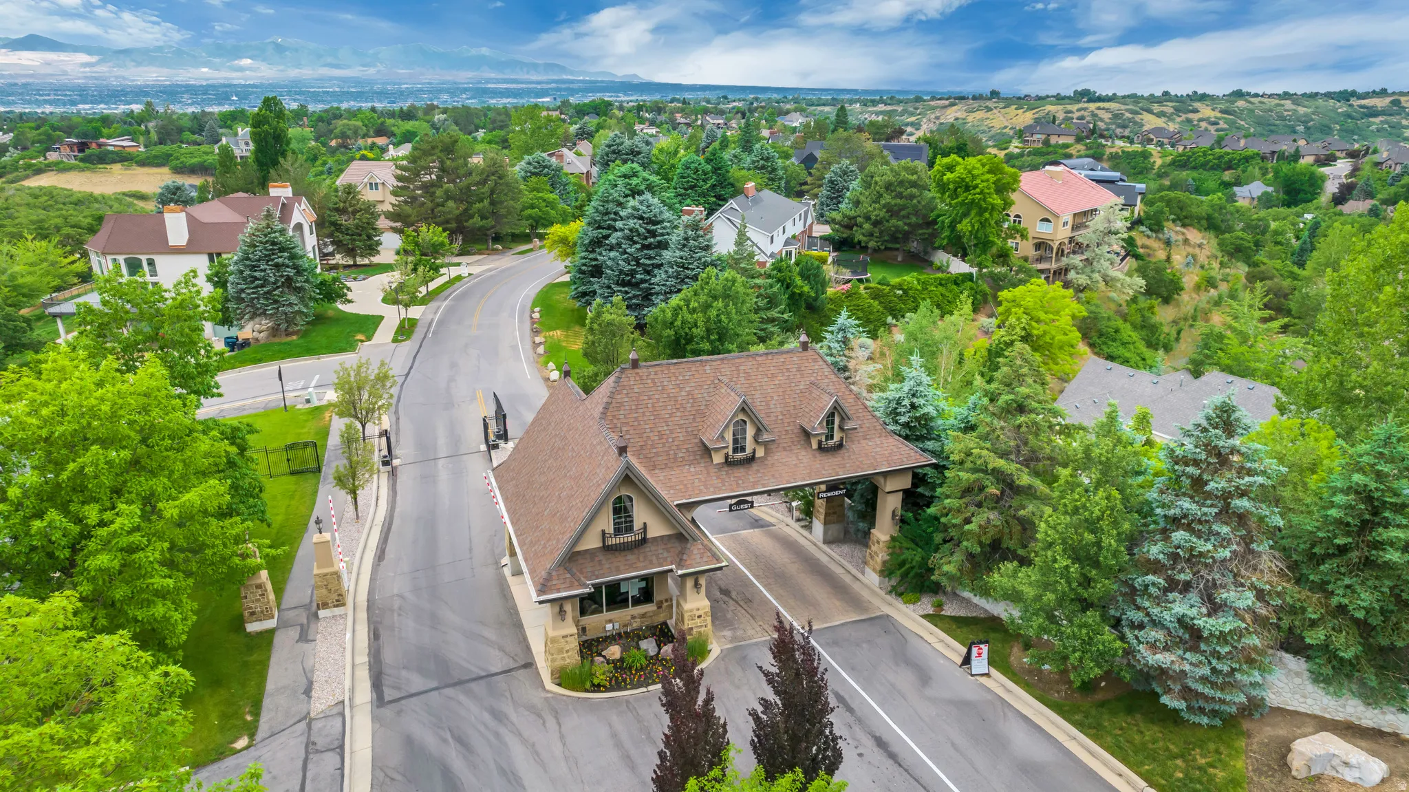 Aerial perspective of suburban area with a tree filled landscape