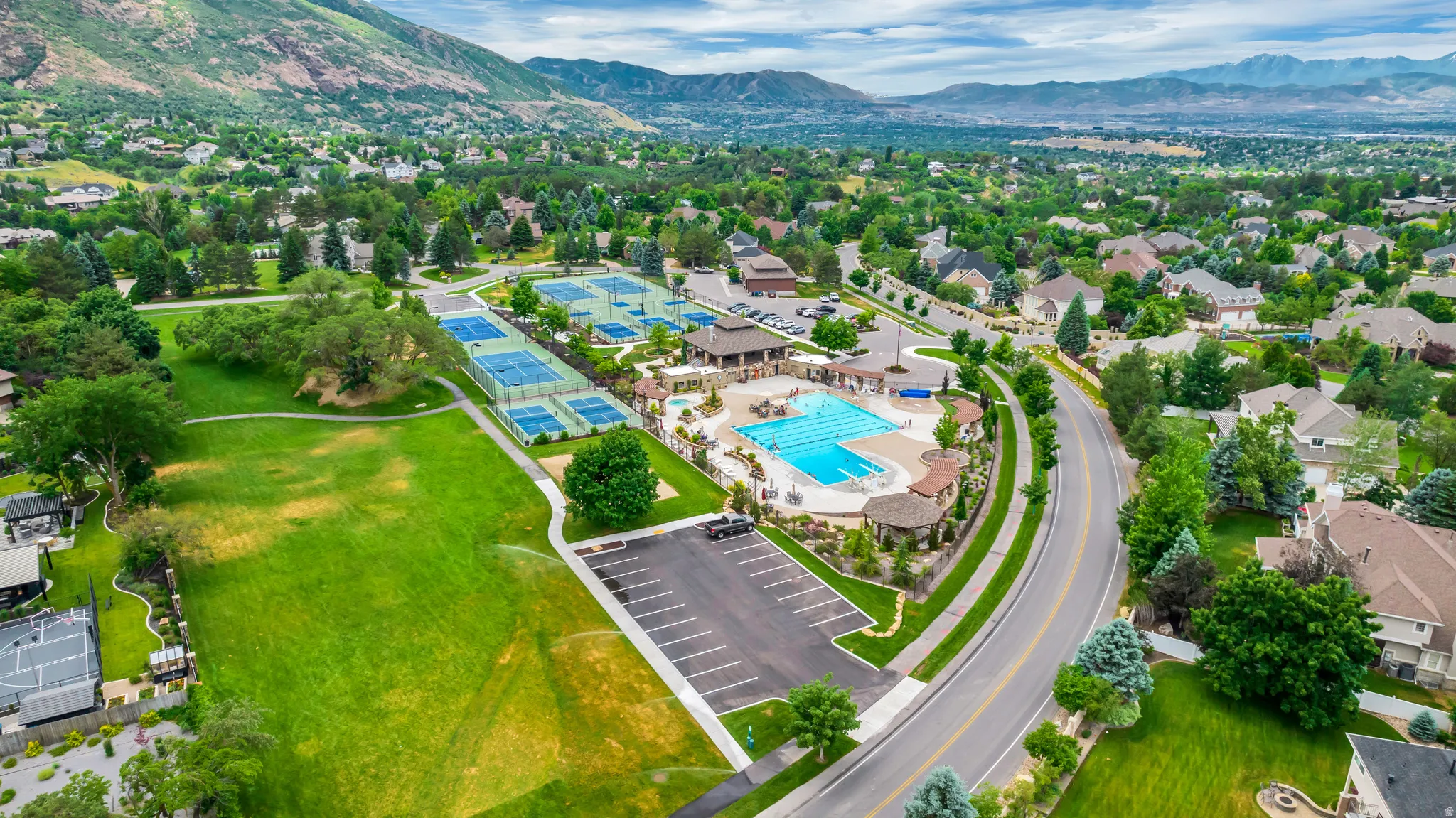 View of property location with a mountain backdrop and nearby suburban area